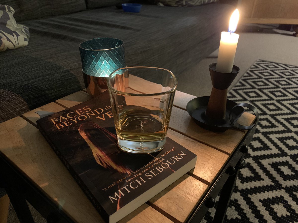 RossJeffery_'s tweet photo. Settling down for the evening with a whiskey, atmospheric lighting and the wonderful @mnsebourn for company in the way of his fabulous short story collection ‘Faces Beyond The Veil’ - another writer who I bloody love and am very thankful for discovering! https://t.co/9FbpgQIHhh