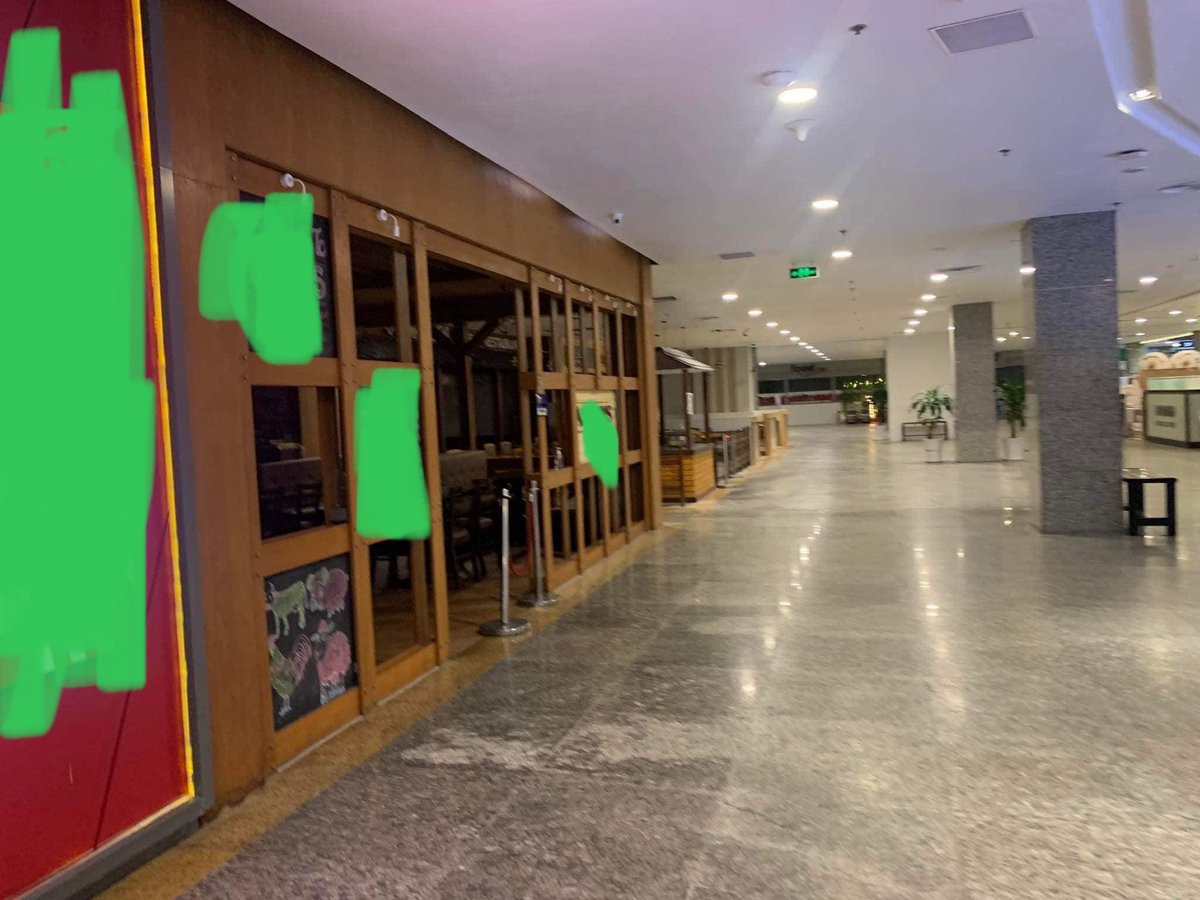 LeongWaiKitCNA's tweet photo. A day after 2 anti #Myanmar army protesters were reportedly punched by security guards in Myanmar Plaza, people boycotted the mall 

I edited the photos from @Khithitofficial to mask the merchants — my intention is to show emptiness https://t.co/A7CgsraHCr