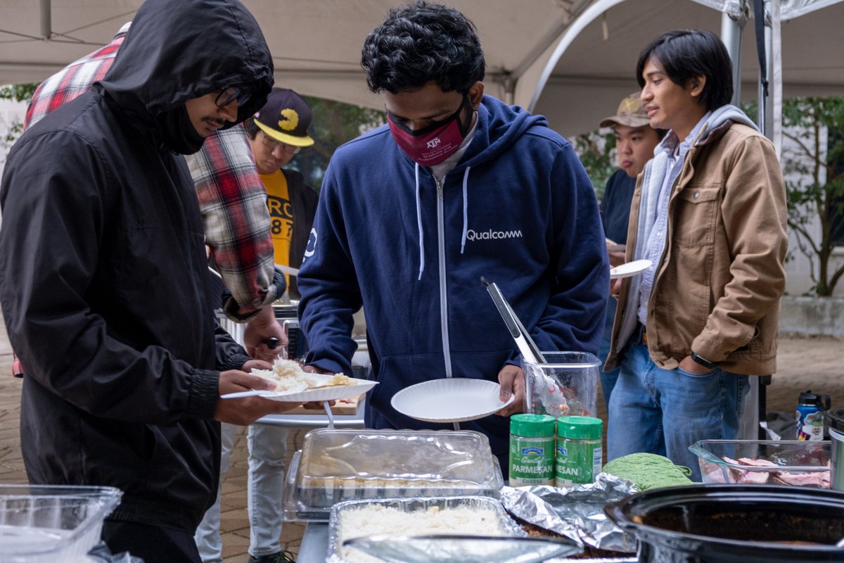 TAMU's tweet photo. About thirty Aggies gathered at the Liberal Arts plaza this evening to share a potluck Thanksgiving meal. 

This Ags-giving was coordinated through social media, flyers, and word of mouth to make sure anyone who was not able to leave campus could enjoy a festive meal. https://t.co/8LFsZlOIWo