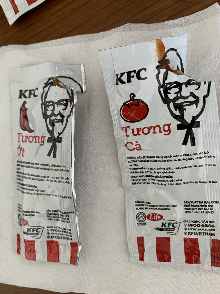 Myrexpeter's tweet photo. @kfc @kfc_vietnam Not sure if KFC realizes how bizarre the way KFC making their packaging. I am here in Vietnam and just realized you have to tear the Colonel head to squeeze out the ketchup (like blood). Not very good Feng Shui. Can you change to tear from the bottom? https://t.co/UtO4E4MUef
