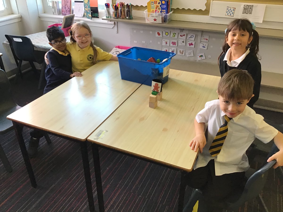 Building bridges to help the Gingerbread Man cross the river safely! @eastbankpri #STEMchallenge