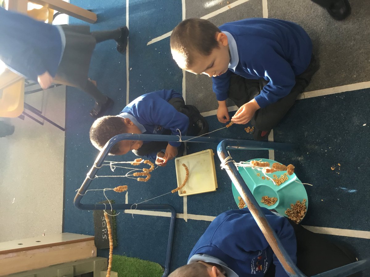 longshawinfants's tweet photo. The squirrels have eaten all our apple bird feeders so the Butterflies worked really hard to  make another tasty treat for them. Threading the cereal on the string was tricky but they kept at it until the job was done! https://t.co/9LqpJhKSTC
