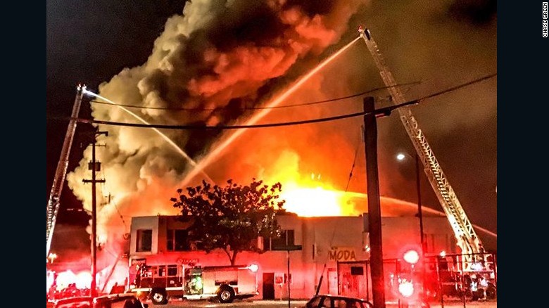 NAofSFM's tweet photo. On 12/2/16 36 people died in the Ghost Ship Fire. The warehouse had been illegally sublet into living spaces w/wooden studs, steel beams, &amp; furnishings. The bldg had no smoke detectors, fire alarms, or sprinklers, only 2 exits, &amp; had not been inspected. #FireHistory #NeverForget https://t.co/4qnZqZc9nm
