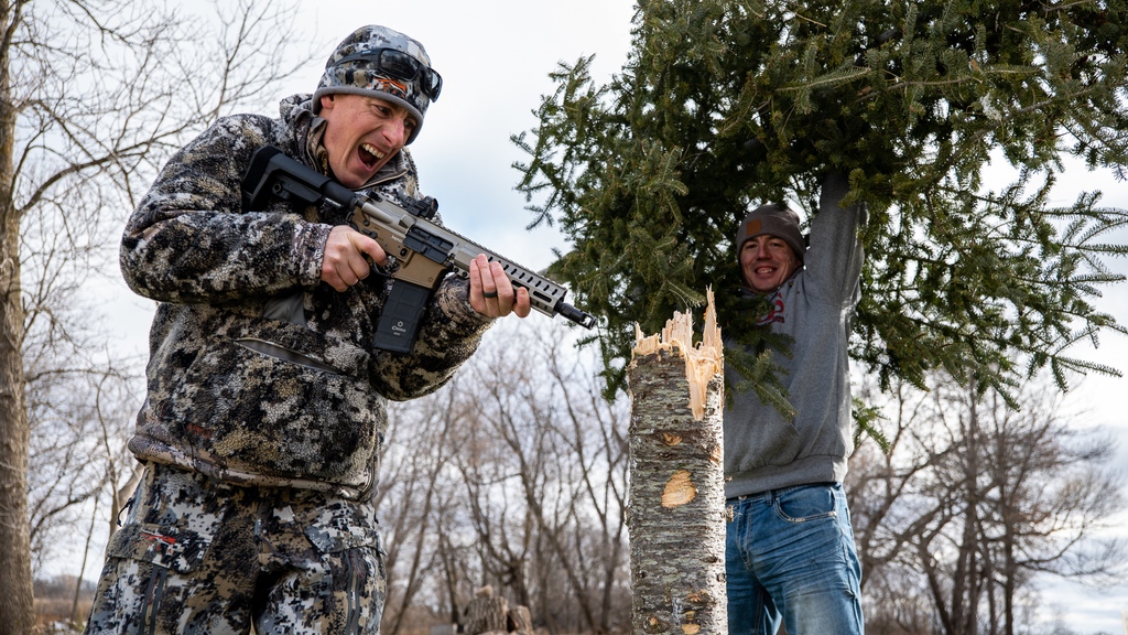 GouldBrothers's tweet photo. It's time to shoot down our Christmas tree 🎄 This year we selected the CMMG Banshee 9mm Pistol 🔫 as our tool of choice. How many shots do you think it took to chop down this tree? Comment below and then check out the video https://t.co/tuJsVV0APE https://t.co/FSC5bDygzS