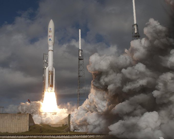 Rocket launching with billowing smoke filling the left of the image.