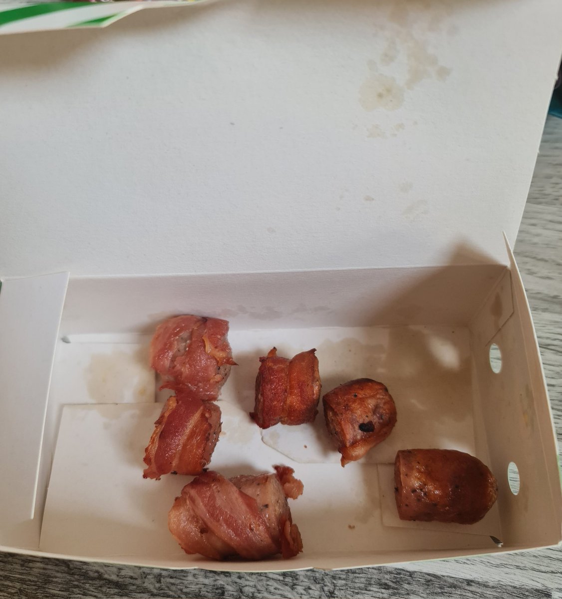 oli_wal's tweet photo. As a pig in blanket fan, I must admit to being rather disappointed by @SubwayUK when these half-pigs arrived with two of them blanketless. I wasn't expecting exactly what was in the sales photo, but expected closer than this embarrassment. https://t.co/fSj1CS3011