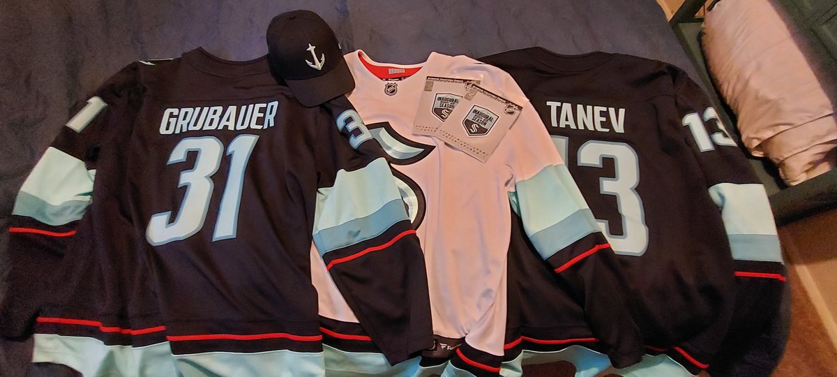 PrestonCabeza's tweet photo. There was a good sale on jerseys today so I rounded out the collection! The Grubauer one is for Caitlin @SeattleKraken #letsgokraken #Grubauer #Grubi #brandontanev #turbo https://t.co/ICOyifCMn9