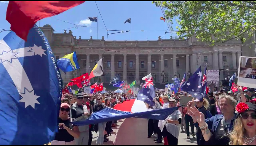 BethanyCherisse's tweet photo. Melbourne CBD.
Parliament House.
11.45am, Nov 26th 2021.
Week 5 of non-stop protests.
Fifteen minutes till official rally start time - the streets are filling quickly.
#NoVaccinePassportsAnywhere
#ReclaimTheLine
#OccupySpringSt
#SomyurekTheBill
#KillTheBill
#SackDanAndrews https://t.co/oGwquTUigz