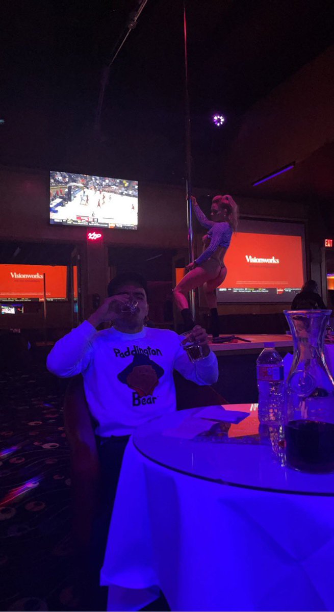 At the strip club in the paddington bear fuzzy sweater