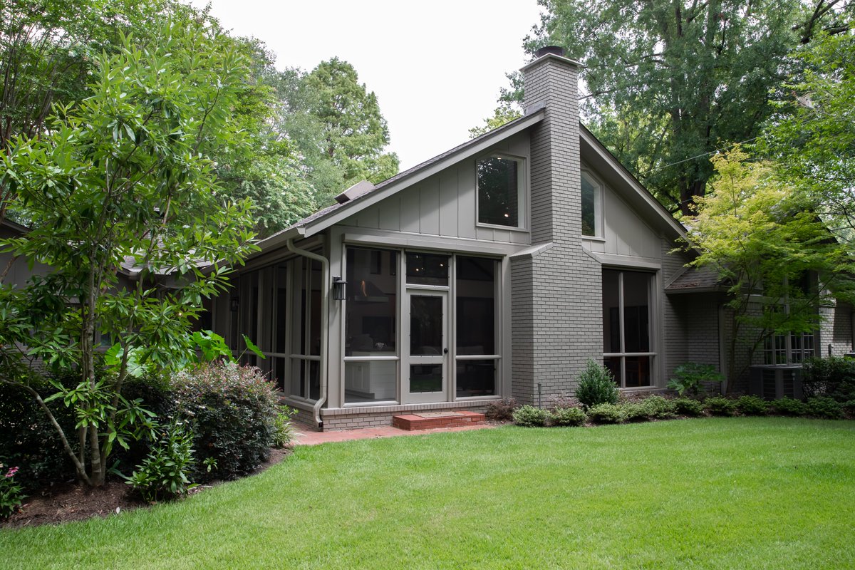 Windows! Tim Disalvo designed and built this spacious sunroom with an open floor plan  in East Memphis, TN.  

The retractable shades that cover all the windows are remote-controlled.  The mini bar was a great finishing touch to give this Add-on everything!