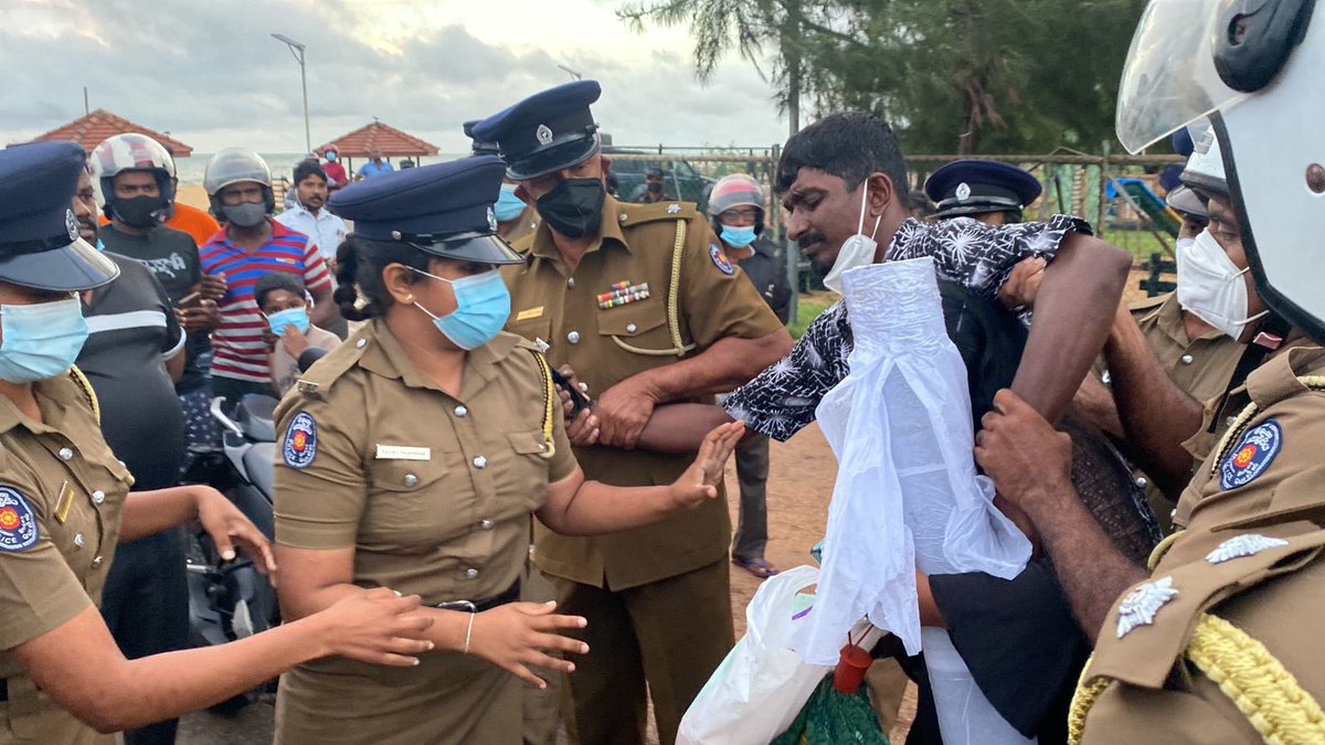 TamilGuardian's tweet photo. BREAKING - ITAK member Peter Ilancheliyan and his wife have been manhandled and arrested by Sri Lankan police for attempting to hold a memorial on Mullaitivu beach. https://t.co/VRekhMWm1S