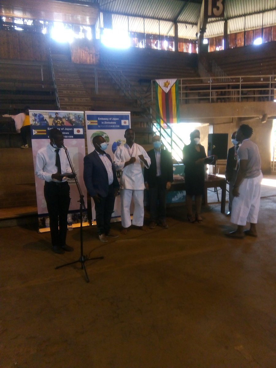 Being presented my medal for  above 75kgs kumite (fight) by President of Zimbabwe Karate Federation Shihan Joe Rugwete and His Excellency The Ambassador of Japan Mr Satoshi Tanaka.