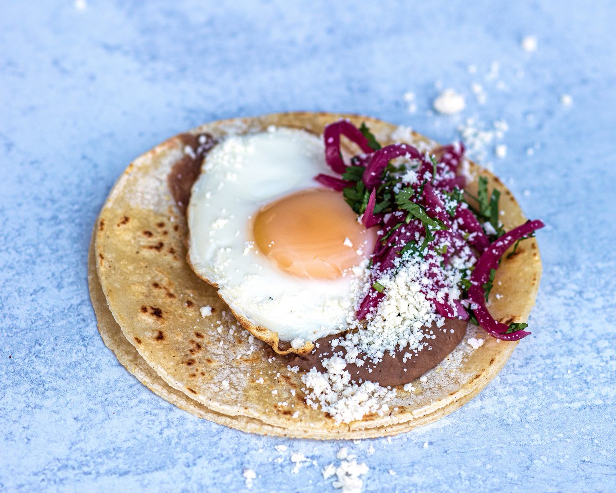 TacoBamba's tweet photo. New for breakfast: Huevo Frito Taco with a fried egg, pinto beans, cotija, pickled onion and cilantro.
#prepareyourmouth #breakfasttacos #tacosforbreakfast #breakfastfood #breakfastallday #freecoffee #dmvbrunch https://t.co/ivD3mY16DG