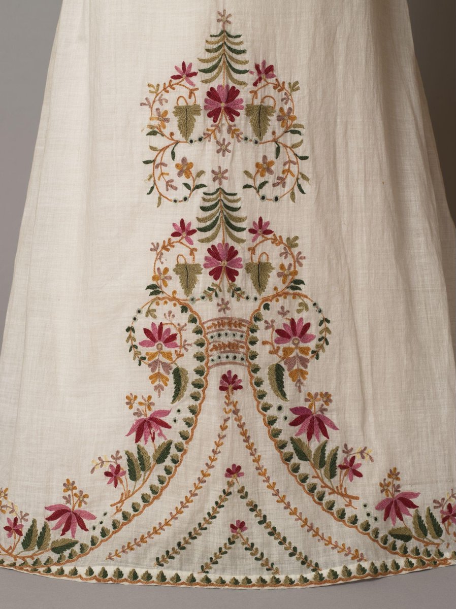wikivictorian's tweet photo. Girl's dress with high waist and puffed sleeves, white muslin embroidered from the hem with a floral design in coloured wool, made in England, 1812-15. Victoria &amp; Albert Museum. https://t.co/np2IqWtNNt