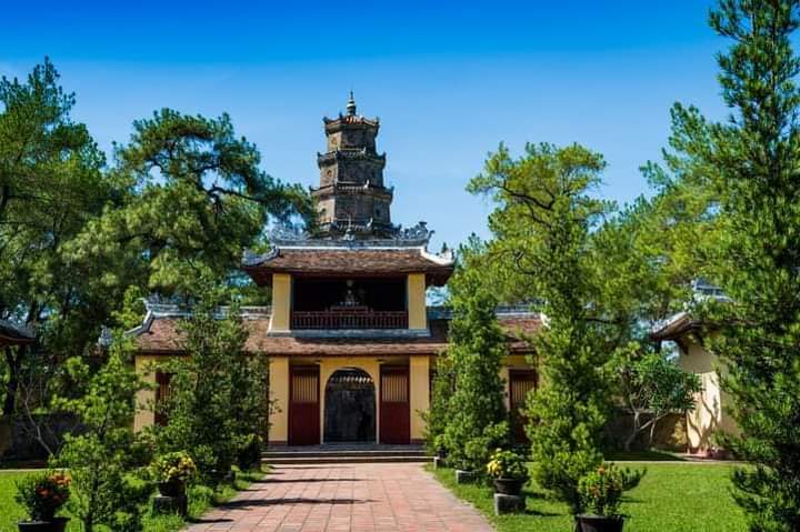 ViettinT's tweet photo. Located on the bank of the #HuongRiver, #ThienMuPagoda with its typical architecture has become one of the most popular attractions in #HueCity. You should visit this sanctuary in the afternoon to enjoy the beautiful sunset on the poetic #PerfumeRiver. https://t.co/lKEVUqQBPn