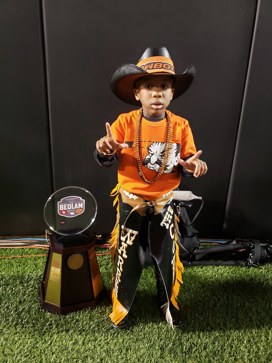 RobClayMotivate's tweet photo. My baby boy #WarrenTheCowboy says, Congrats Cowboys and #GoPokes!!! 
WE ARE THE BEDLAM CHAMPS!!!
🤠🖤🧡 @CowboyFB 
https://t.co/NuNZ3IuOev https://t.co/okJxGic6kk