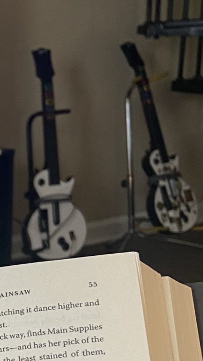 filthopher's tweet photo. @fatlittleass I love the guitar hero guitars on stands. https://t.co/aTpcEmAWR1