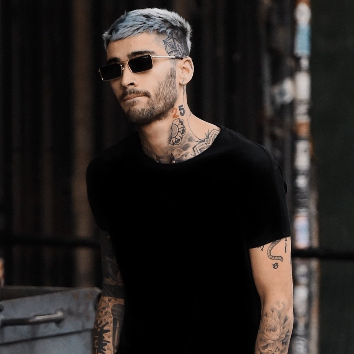 zayn malik and liam payne wearing black shirts and glasses on the streets.  that's it, that's the tweet., image size:1200x1200