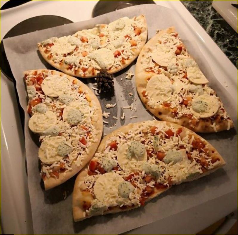 Saw this online: To fit two pizzas into the same pan, cut them in half. A possible geometry exploration?