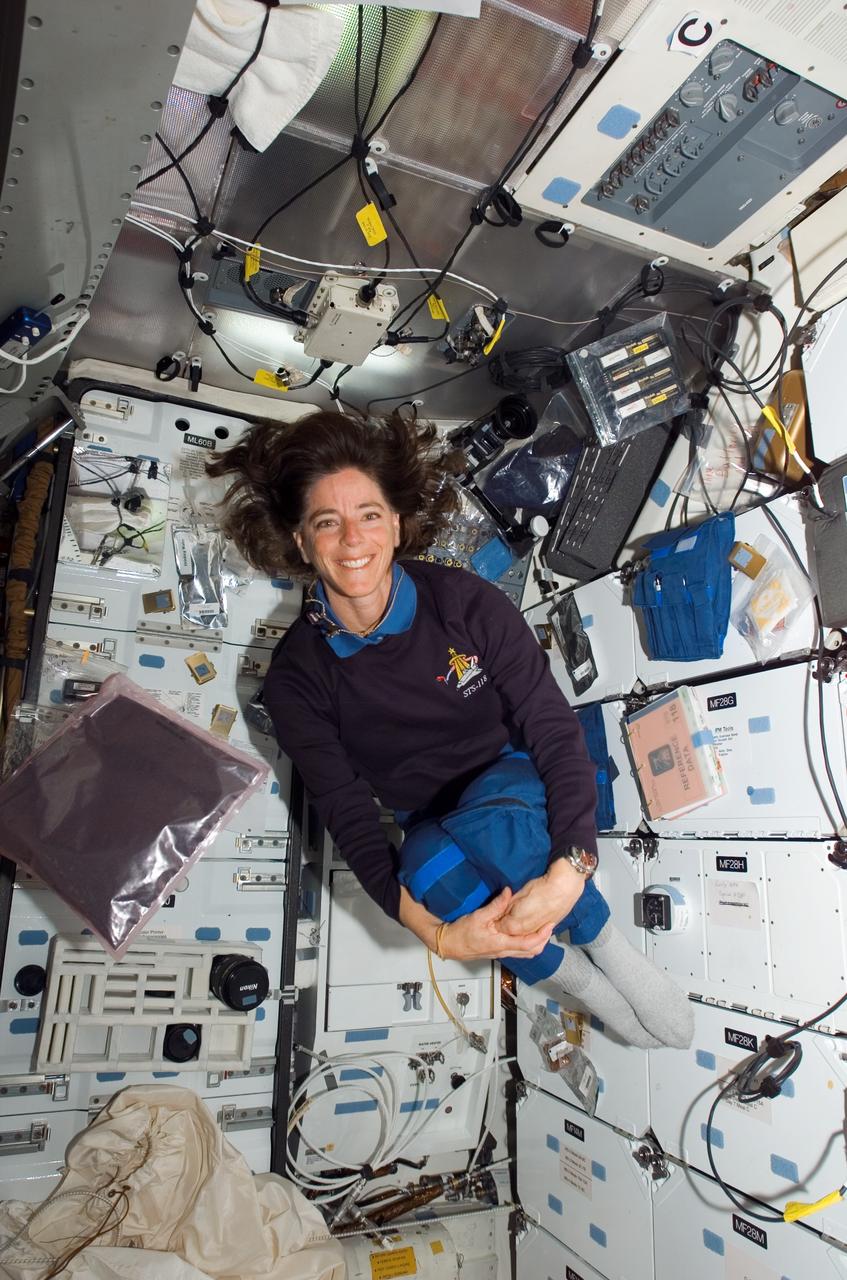 STS-118 Mission Specialist Barbara Morgan happily floats on the middeck of the Space Shuttle Endeavour in August 2007.