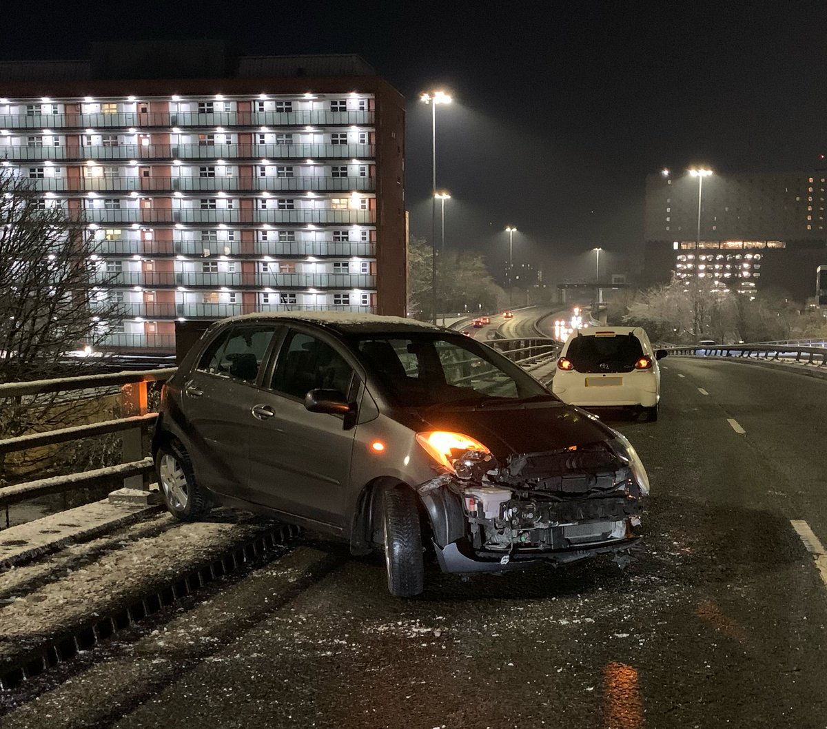 gmptraffic's tweet photo. Mancunian Way is currently closed West Bound at the junction of Ashton Old Road due to a collision. The roads are extremely icy, please drive to the conditions. Police Officers #XT58 + #XT78 are currently assisting #MCC gritting the road in order to reopen the carriageway https://t.co/vtvvdUNjNs