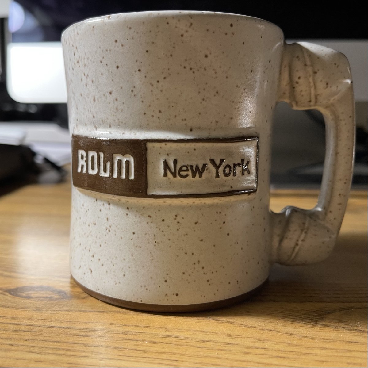 SchnauzerLogic's tweet photo. With the the usual suspects in the sink, I went to the back of the cabinet for a mug and look what I found! Circa 1984 when as 1st year associates, Friggy (RIP) and I were tasked with replacing the law firm's aging key phone system. We 'took meetings' and got swag! #ROLM #CBX https://t.co/ZDJcfzj6Mf