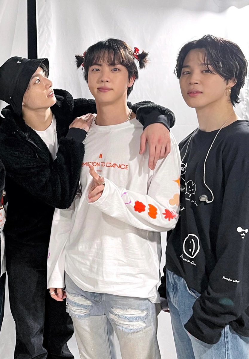 jungkook looking at jin's cute pigtails 🥺