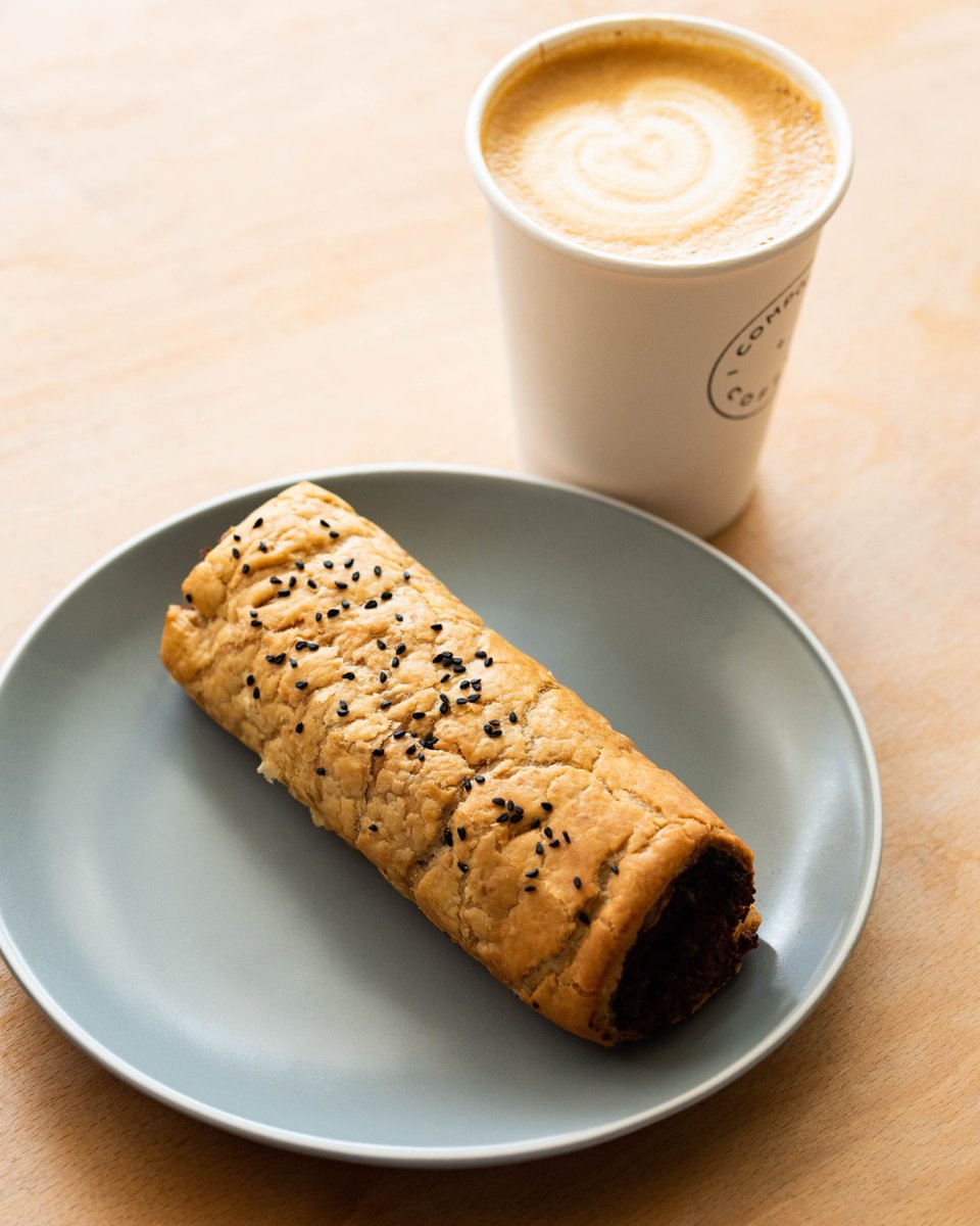 We serve food that's just as good as our coffee. Visit us today and try this tasty vegan sausage roll topped with nigella seeds!