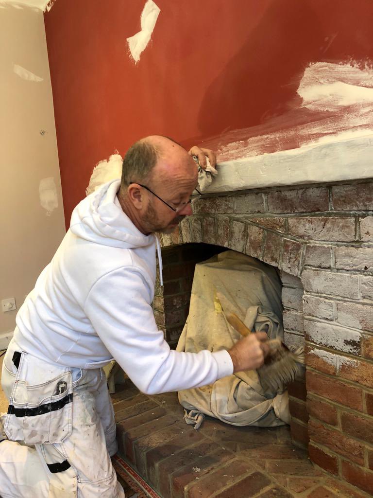 selectdecorator's tweet image. The client wanted to remove the fireplace. I suggested softening the bricks and graining the mantle a weathered oak