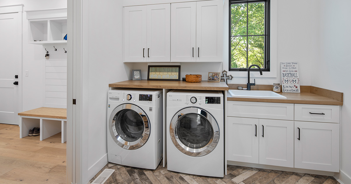 We love the classic combination of function and beauty, which is just what a mudroom leading into the laundry room provides in this home—complete with a utility sink, counter, and storage space. 

wielandbuilders.com

Photo Credit: Greg Grupenhof