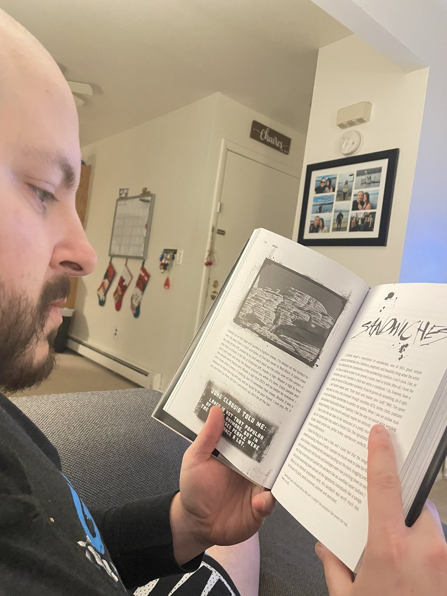 7MichelleLynn's tweet photo. This is my husband @BrianChaires7 reading @JonMoxley new book #MOX, I look over to see there is a chapter called “Sandwiches” 😂 him and @ReneePaquette are meant to be. #MessyInTheKitchen https://t.co/iw74C8hhsT