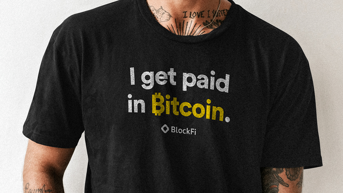 BlockFi's tweet photo. Hard to think of a better vibe than wearing your "I get paid in Bitcoin" tee with your wagmi hat on while sipping from your BlockFi mug. https://t.co/xxSyr54L43
