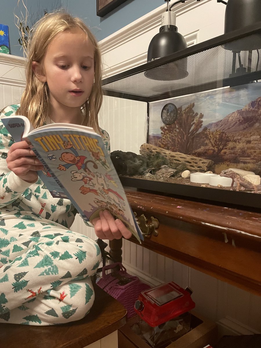 SeanWestaway's tweet photo. If you’ve already seen an 8 year old reading a comic to a leopard gecko today, please move along https://t.co/BBTwnHsMX5