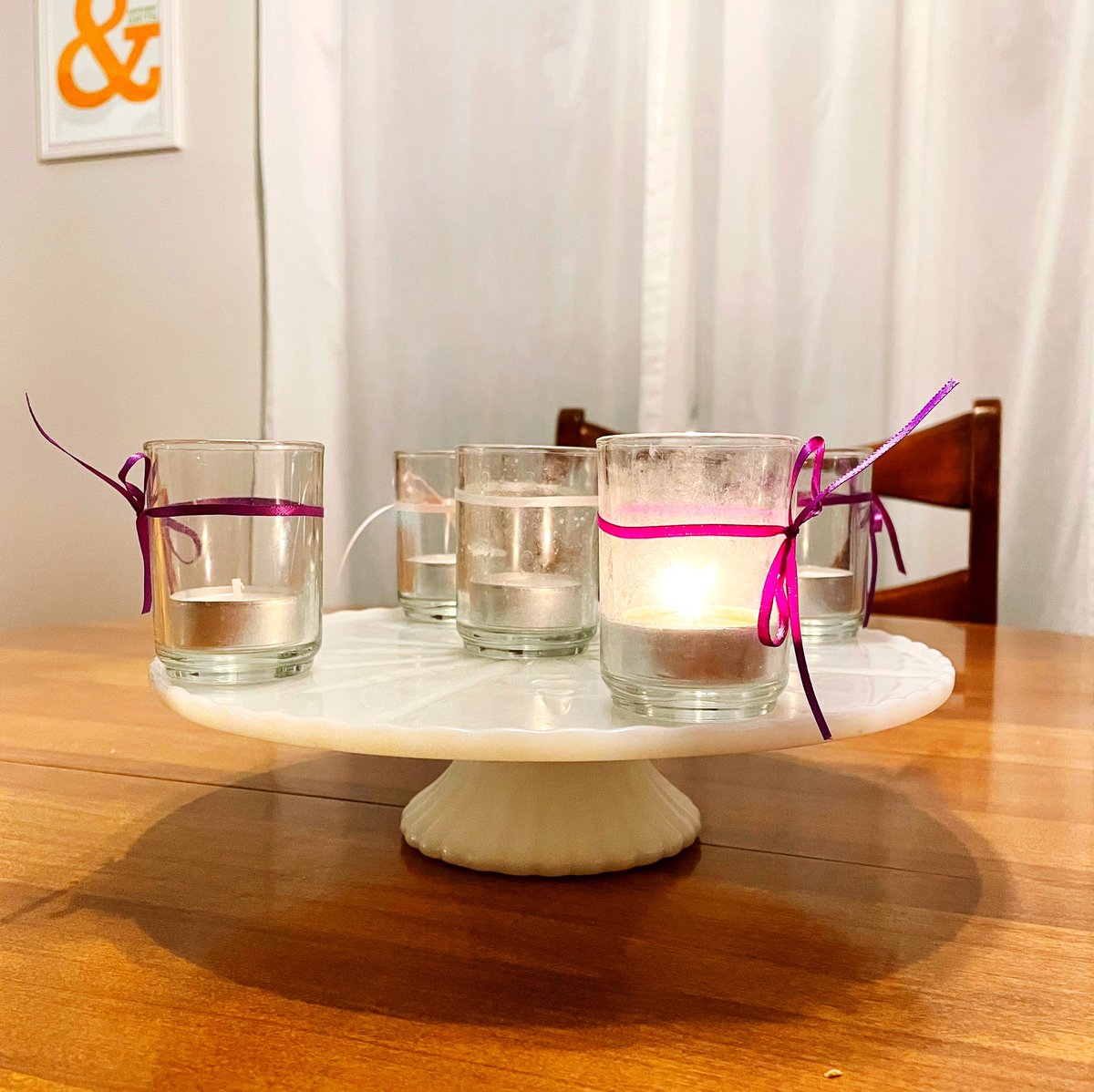 ctyndallwatson's tweet photo. We do Advent with what we got, what we got being tea lights, ribbon, and @evenwatson’s grandmother’s cake plate. https://t.co/WYbqvBsQe4