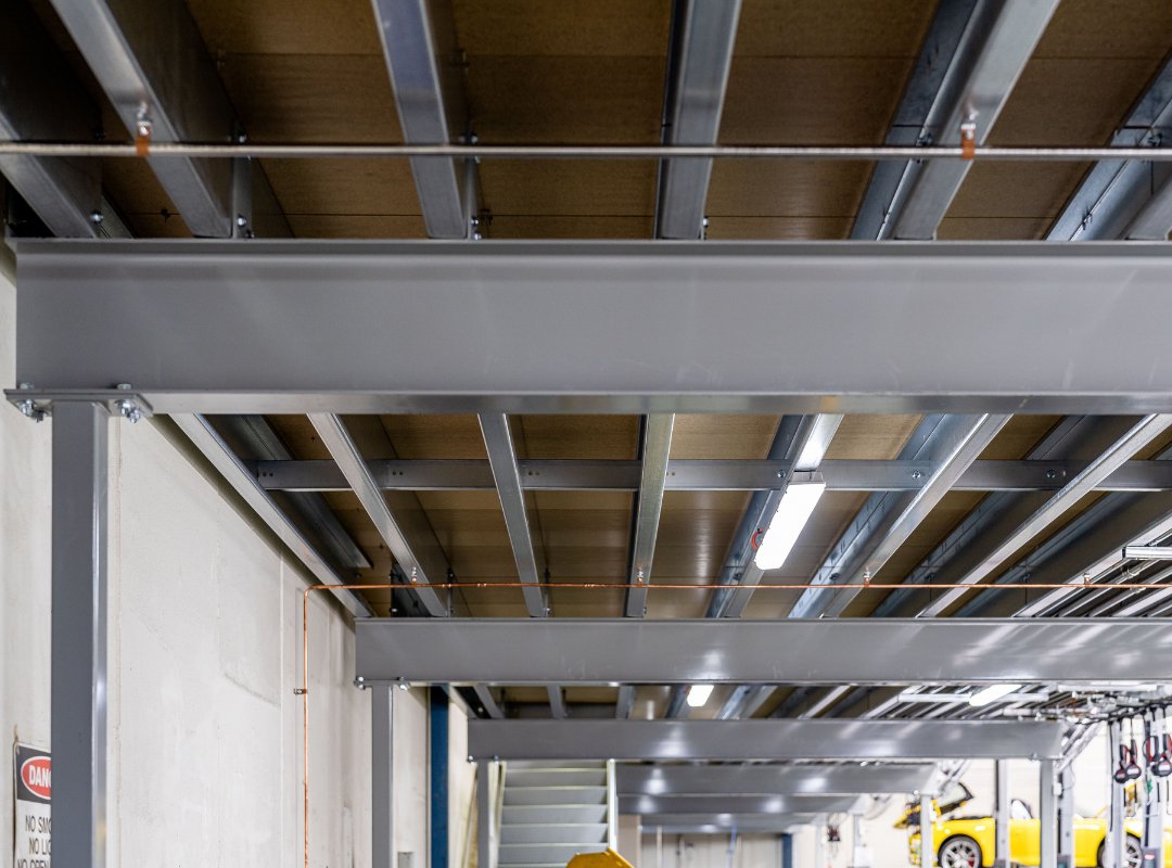 Underside of the #porscheproject mezzanine floor with #unistor manufactured steel structural beams

#unistor #porsche #steel #beams #mezzaninefloor #manufacturing #production #construction