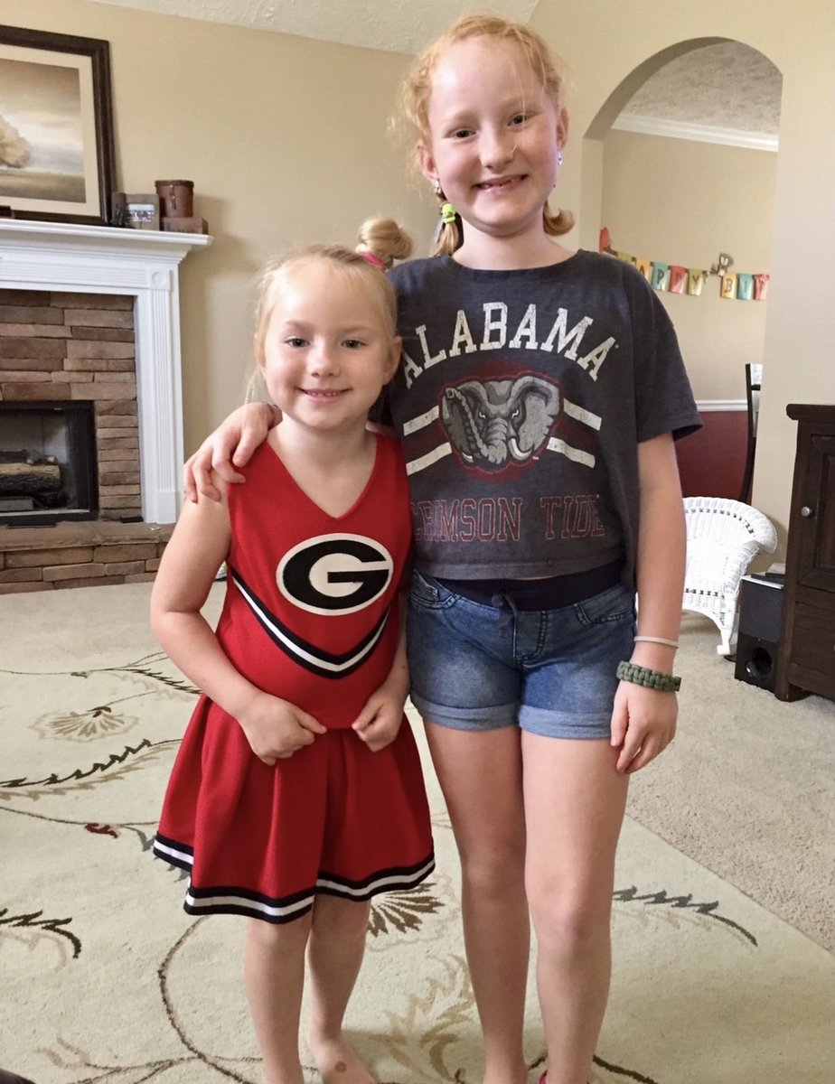 AnnNabors4's tweet photo. A house divided, but the little one just likes the outfit. Grana need to order her a BAMA one! #RollTide #beatga #gahateweek https://t.co/N7esQwmz9u
