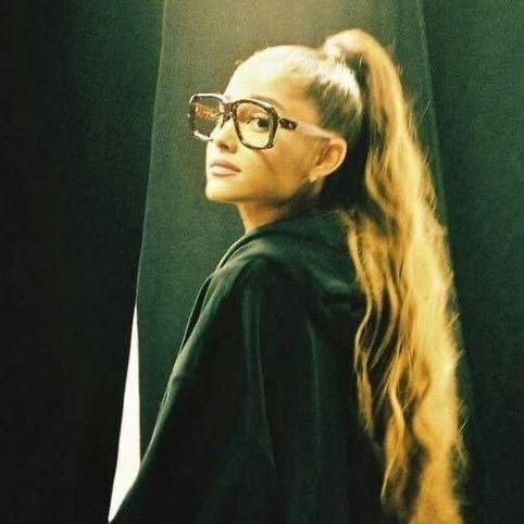 ariana in glasses.