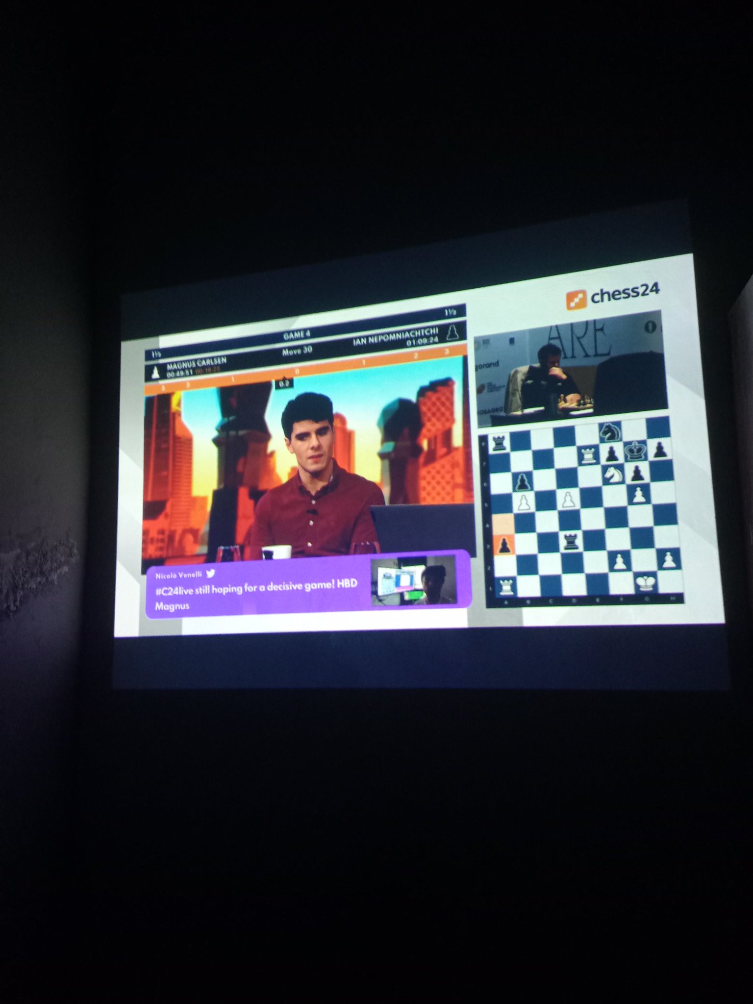 Watching through the projector screen, and happy birthday! Magnus Carlsen. World Chess Championship. 
