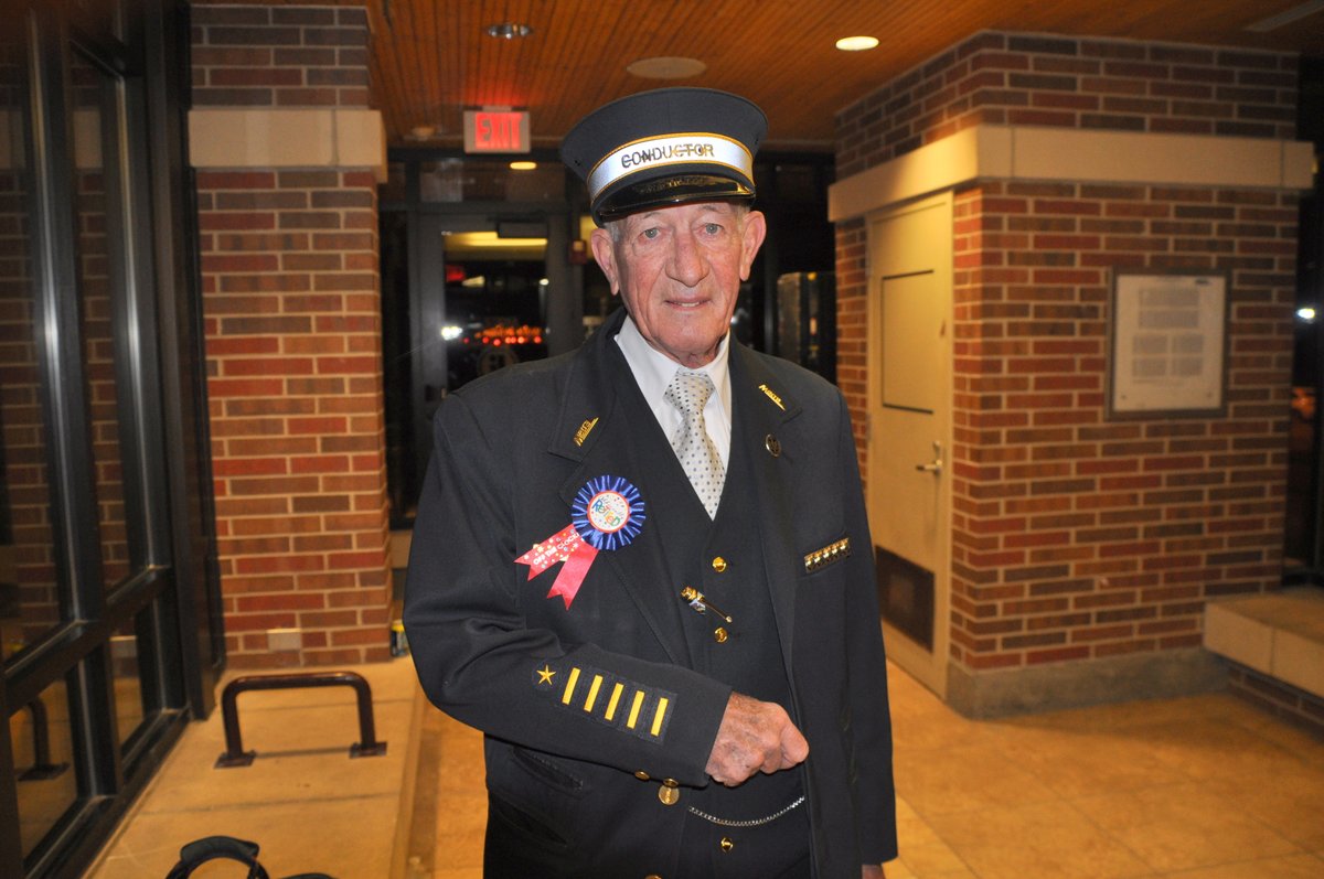 Metra's tweet photo. UP Metra conductor JJ Keigley made his last eastbound trip this morning on Train 16 out of Elburn. Mr. Keigley, well known for his friendliness onboard and his Halloween costumes, started on the railroad in 1967, only pausing his service in 1969 after being drafted into the Army. https://t.co/wqHU0ieSZU