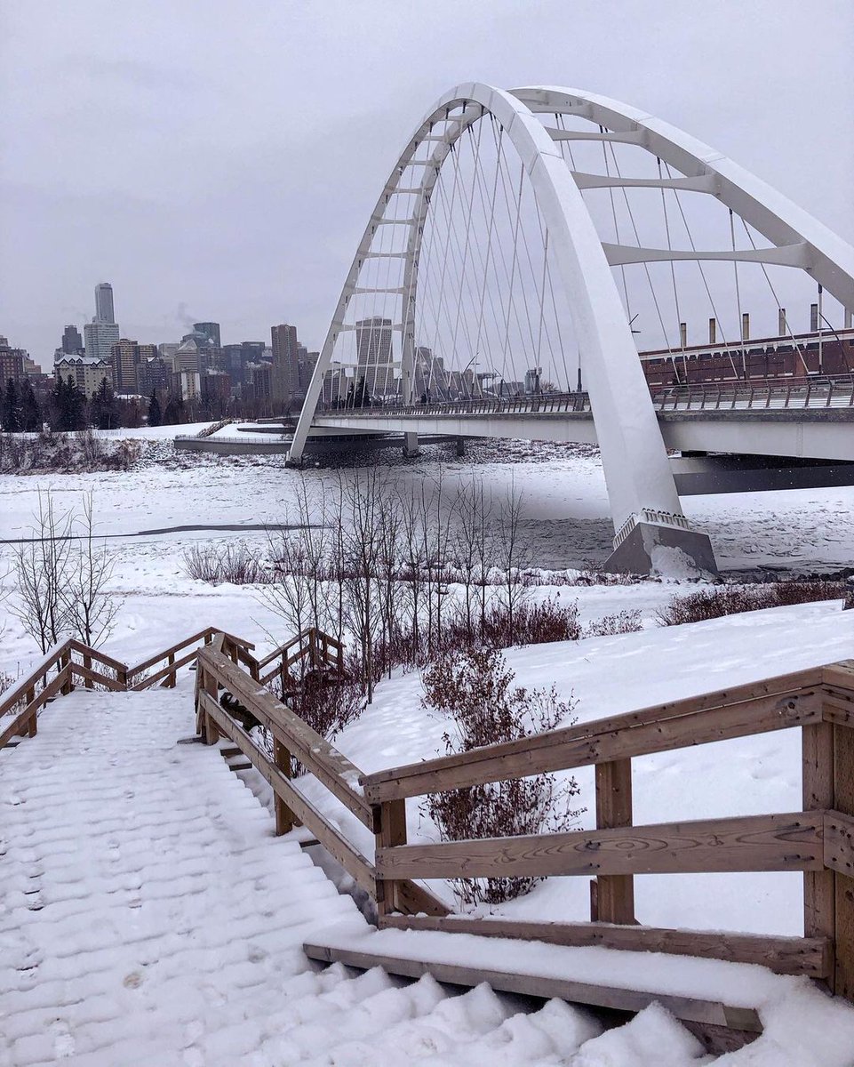 Canada's tweet photo. Summer ➡️ Winter 
 
Whether the river banks are full of green trees or covered in snow, the view of Walterdale Bridge, which was rebuilt after over 100 years, and of #Edmonton’s skyline are always beautiful! 😍 #TransformationTuesday 
📸 kimtannas &amp; capturedbybrandibee/IG https://t.co/hUzd2gWZpy