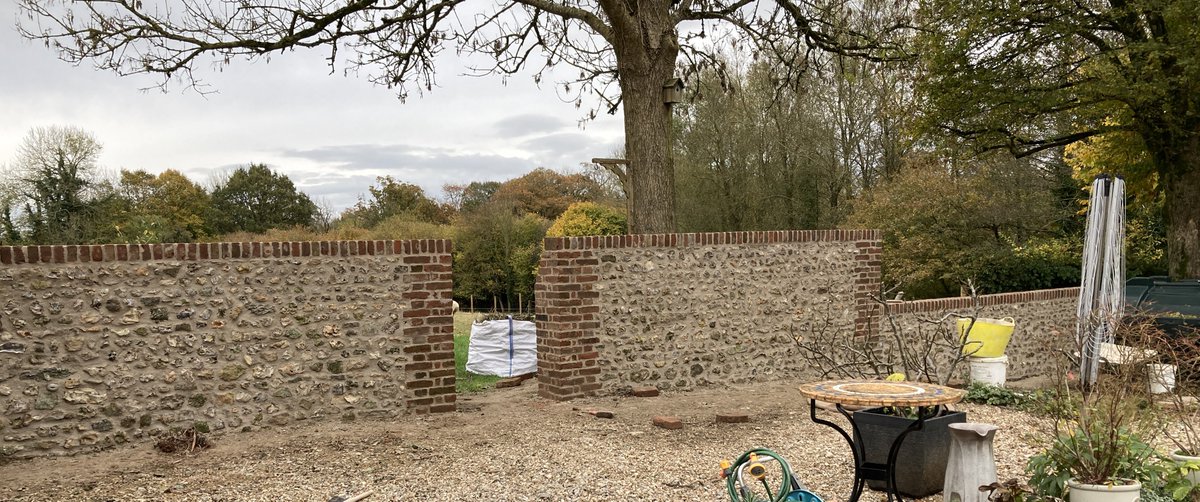 SellickCon's tweet photo. Brick and flint garden wall we had the pleasure of restoring recently #restoration #lime #flint #stonewall #Dorset #traditional https://t.co/EKe5A0apiy
