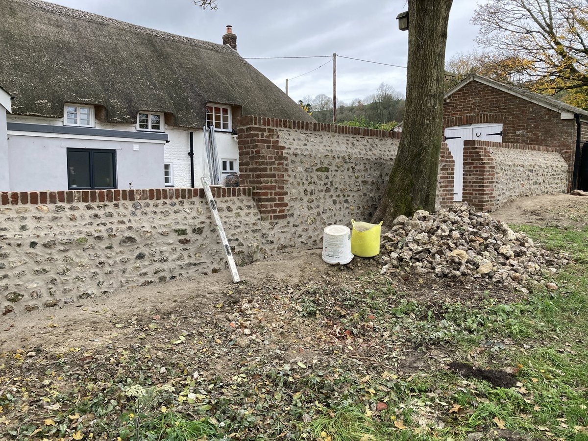 SellickCon's tweet photo. Brick and flint garden wall we had the pleasure of restoring recently #restoration #lime #flint #stonewall #Dorset #traditional https://t.co/EKe5A0apiy