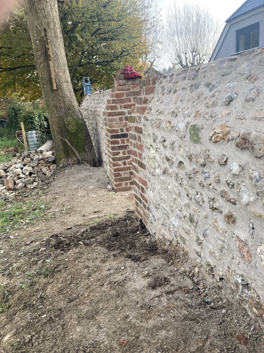 SellickCon's tweet photo. Brick and flint garden wall we had the pleasure of restoring recently #restoration #lime #flint #stonewall #Dorset #traditional https://t.co/EKe5A0apiy