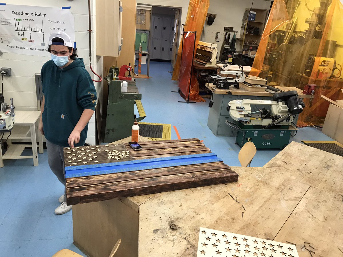 Woods2 student dedicating his flag to a local officer, thanking him inspiring him to find a new hobby. Officer donated wood tools and machines to him and he found his love for #woodworking #change #influence #teched #steam #stem #police