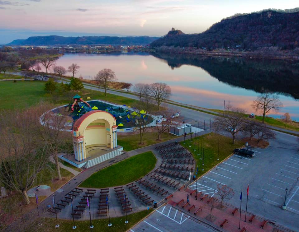 VisitWinona's tweet image. Seriously--even our playgrounds have the BEST views😍😉 This next-level #WinonaMN #sunset scene, complete with mirrored Sugar Loaf reflection and historic #BandShell cameo, has been brought to you by local shutterbug Driftless Drone Photos👏🤗👏