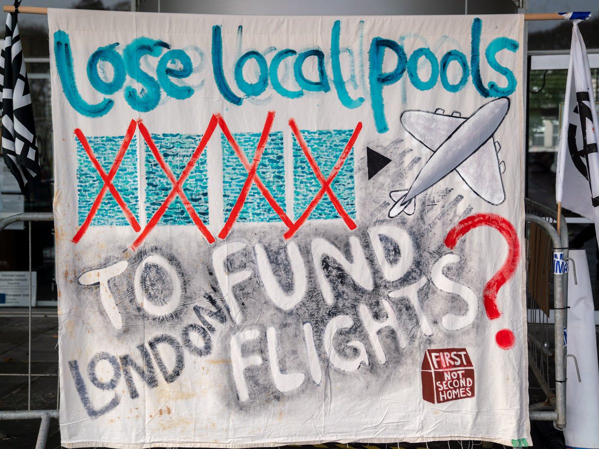CornwallCAC's tweet photo. #SwimsNotFlights #SaveOurSwims Some of the activists pointing out that @CornwallCouncil is supporting flights to London for the same amount as it will cost to keep our swimming pools open. https://t.co/ufmKjq06V5