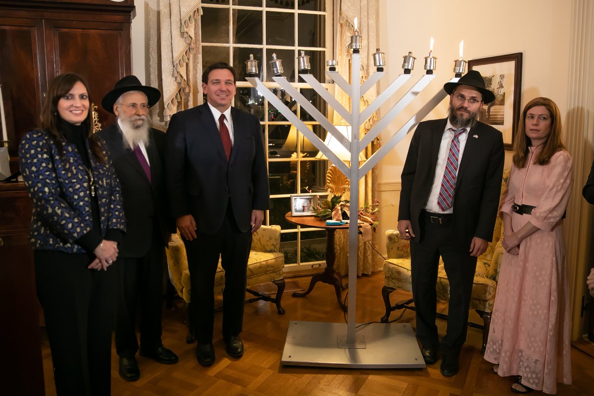 GovRonDeSantis's tweet photo. It was a pleasure to light the menorah on the second night of Hanukkah. @FLCaseyDeSantis and I wish all of our Jewish friends celebrating in Florida and around the world a Happy Hanukkah. https://t.co/a3mpVCidRa