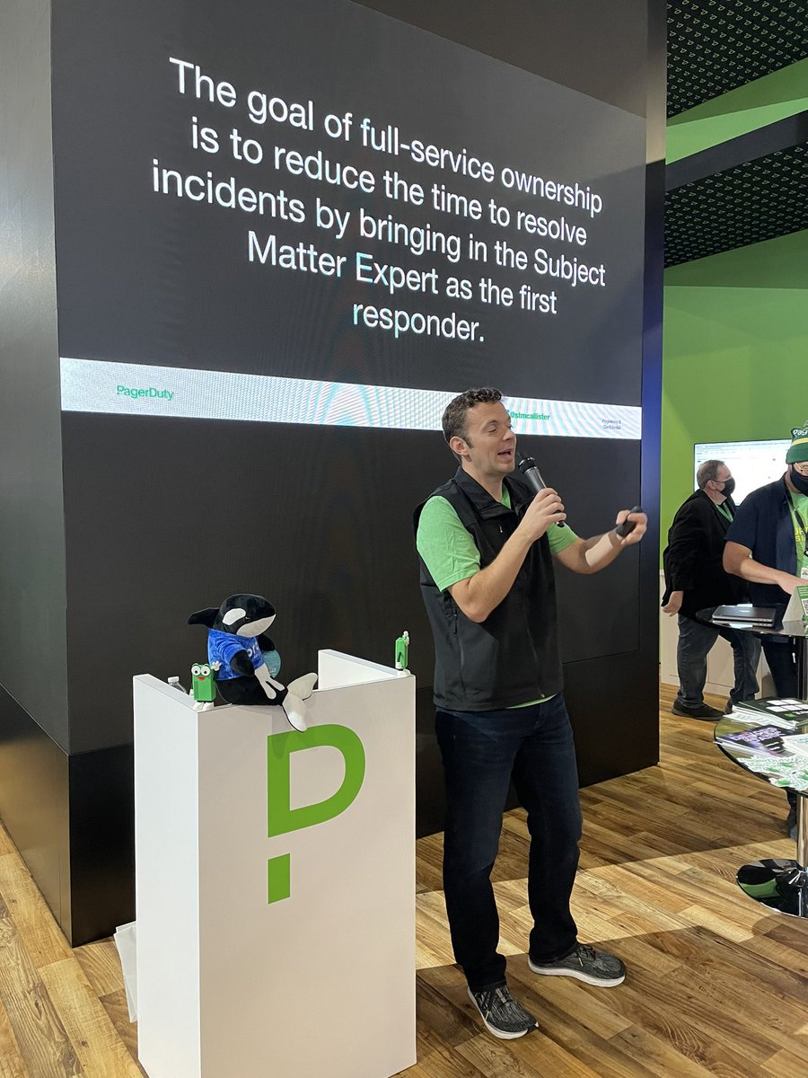 MaryamL's tweet photo. @stmcallister doing a great job at the #PaderDurty booth. @OrkieOrca loves it too! #reinvent @orcasec #AWSCloud https://t.co/1qT93vvny9