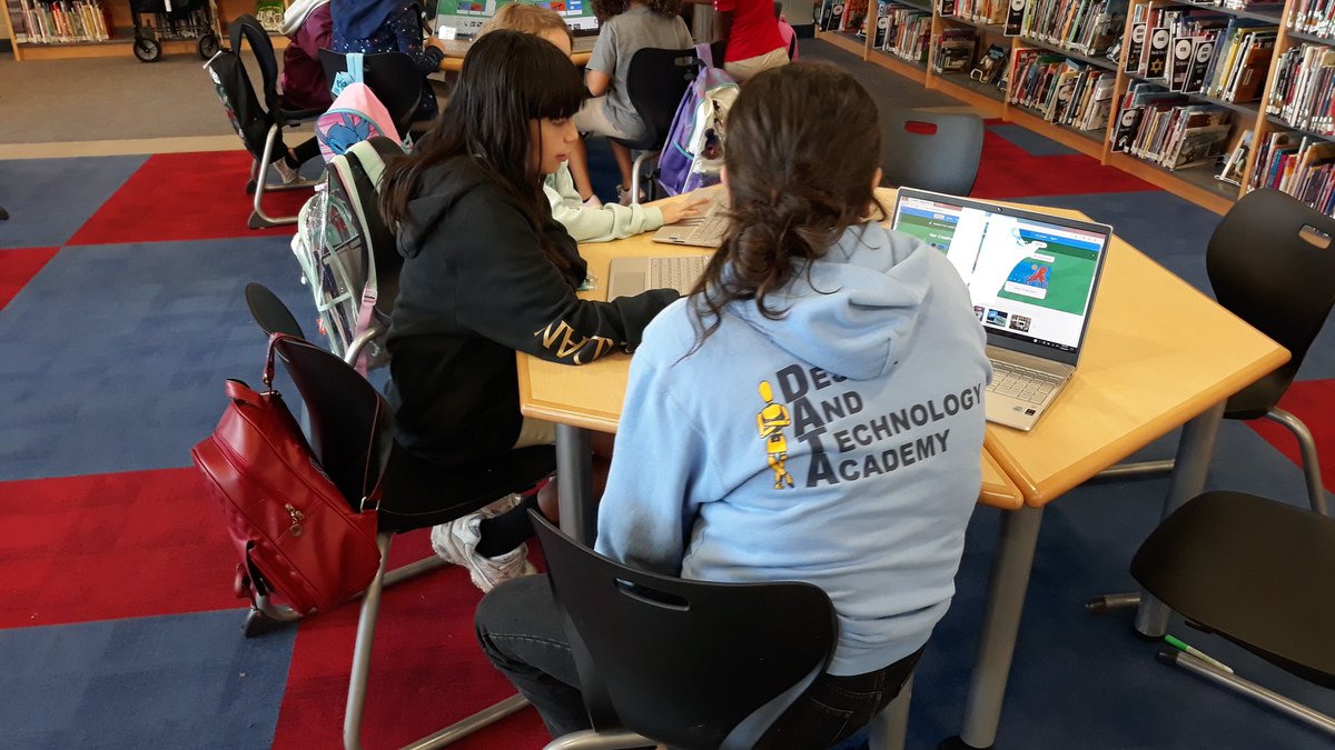 BWhirledCulture's tweet photo. Showing off our AMAZING code and providing our neighbors with feedback on their creations! Making our dinosaurs dance at the Dinosaur Dance Party is AWESOME! #CoderPals #DATADoes @dataedwhite @CamelotNEISD @NEISD https://t.co/xsFf1h2n5x