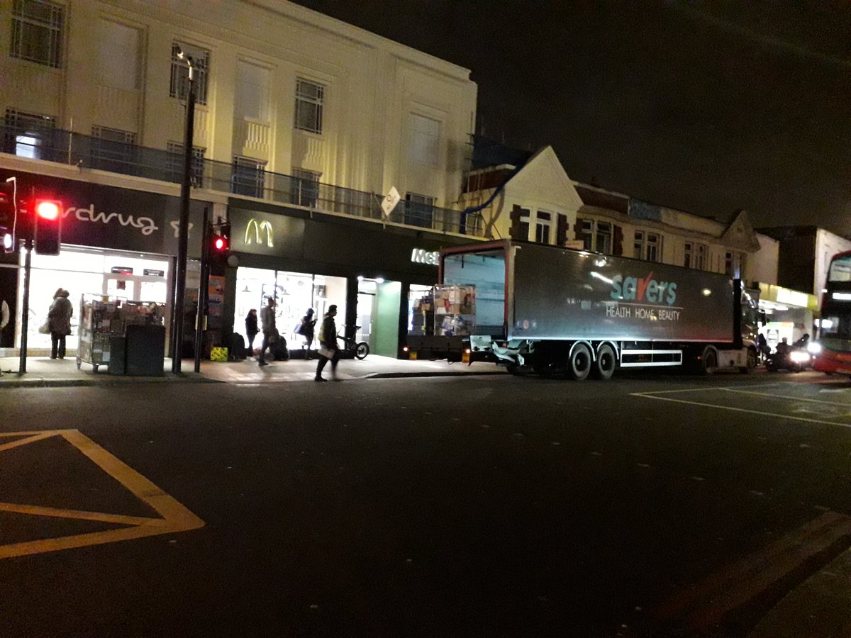 Tottenham High Road N17 on 30th November 2021. A lorry on double red lines outside McDonalds near the pedestrian crossing delivering stock to the Superdrug shop. And loose wire dangling fron shop next to Elbow Roon. So lots for Haringey Enforcement to get stuck into. #IAmHaringey https://t.co/MCupar9azg